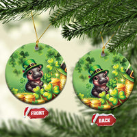 Green circular St. Patrick's Day ceramic ornament with cartoon bear, clovers, and coins.