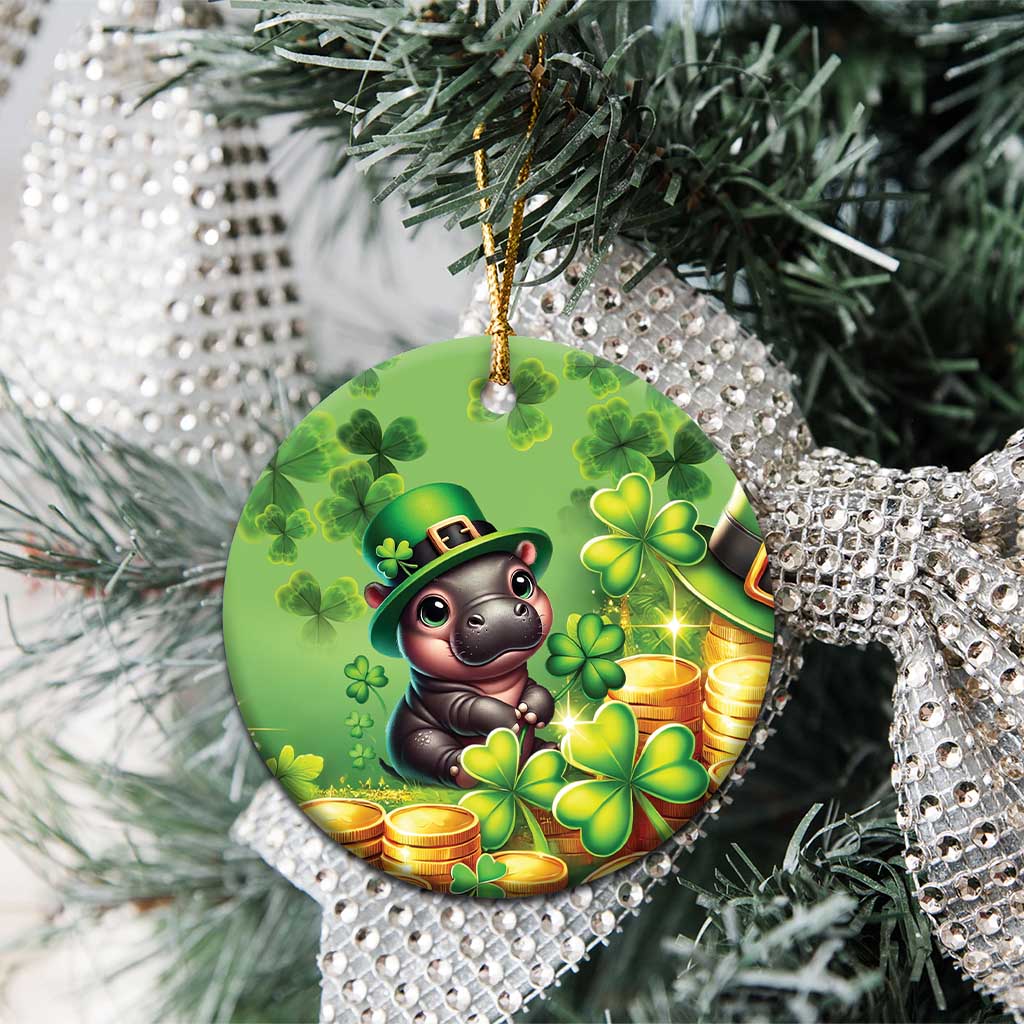 Green circular St. Patrick's Day ceramic ornament on tree branches; cartoon bear, clovers, coins.