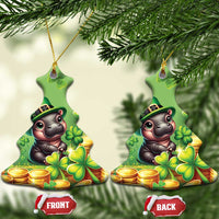 Green bell-shaped St. Patrick's Day ceramic ornament with cartoon bear, clovers, and coins.