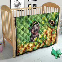Green St. Patrick's Day quilt on a crib with cartoon moose, clovers, and gold coin stacks