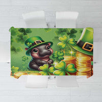 Green St. Patrick’s tablecloth with cartoon leprechaun cat, coins and shamrocks