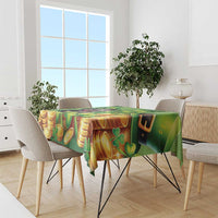 Green tablecloth with gold coins and shamrocks, leprechaun hat design on table