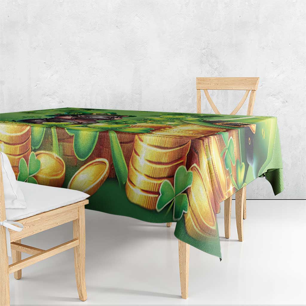 Green tablecloth with gold coins and clover pattern, draped over bench edge