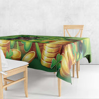 Green tablecloth with gold coins and clover pattern, draped over bench edge