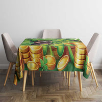 Green St. Patrick’s tablecloth with gold coins and shamrocks on a dining table