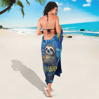 Deep blue sloth sarong worn as a wrap, showing sloth graphic centered on the back