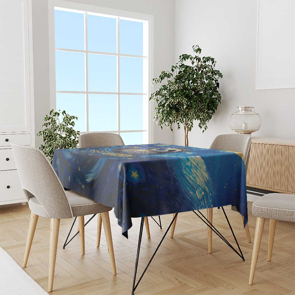 Blue starry night tablecloth with galaxy swirl pattern on dining table