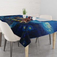Blue starry galaxy tablecloth draped over dining table with matching corner drops