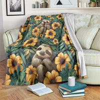 Green sloth and flower blanket draped over a couch arm, showing sloth faces and yellow blooms