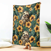 Green sloth and flower seamless style blanket with two sloth faces and large yellow blooms