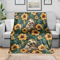 Green sloth and flower blanket spread on a light couch, with large yellow flower patterns