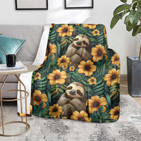 Green sloth and flower blanket with two sloth faces and yellow blossoms, shown on a floor