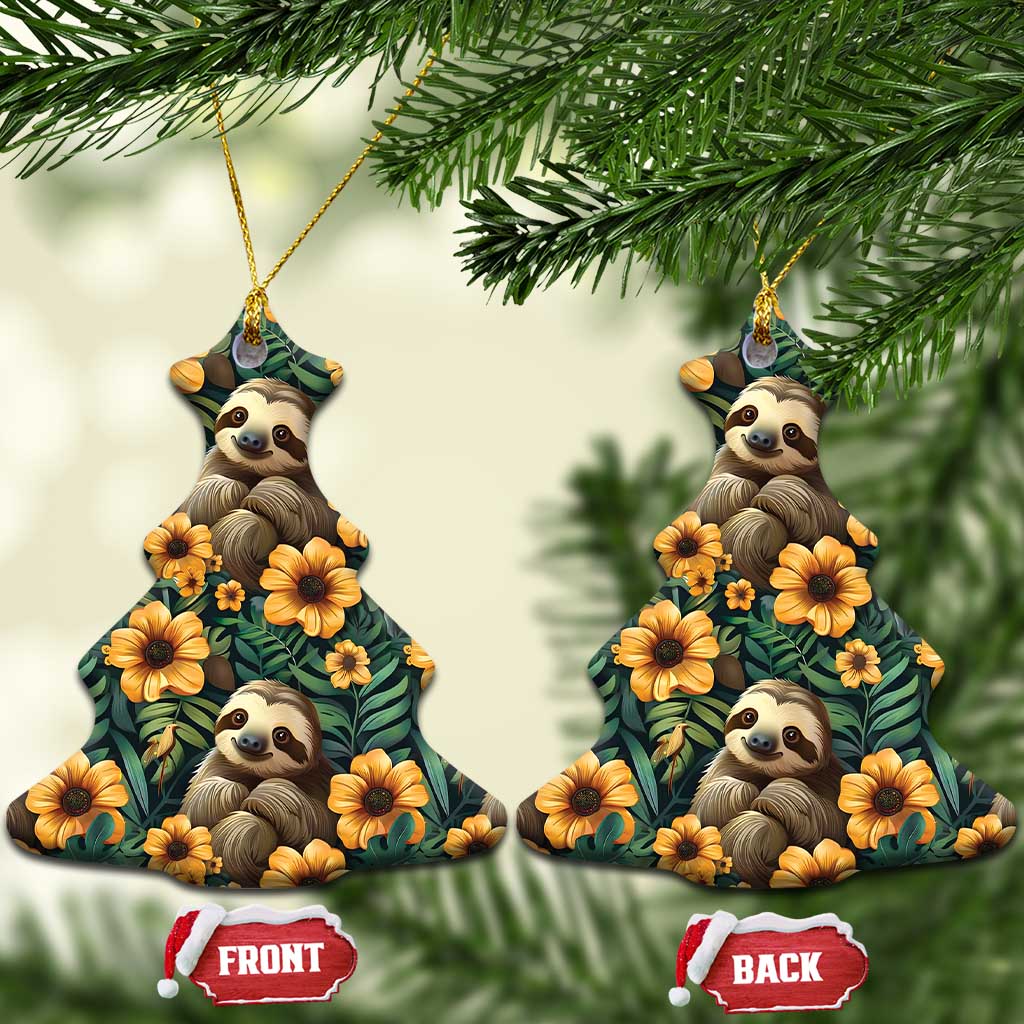 Christmas tree-shaped ceramic ornament with sloths and orange flowers on dark green leaves