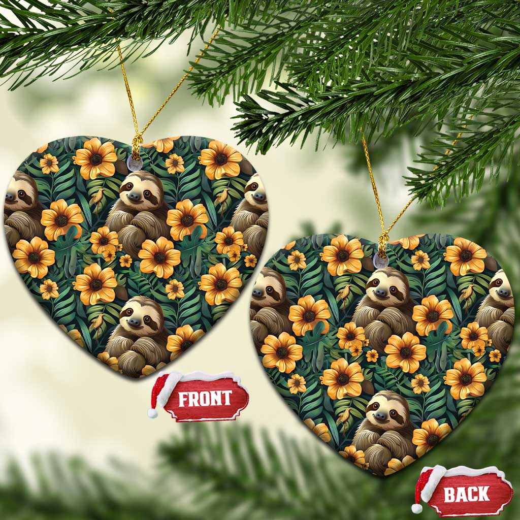 Heart-shaped ceramic ornament with sloths and orange flowers on dark green foliage pattern