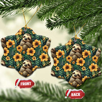 Snowflake-shaped ceramic ornament with sloths and orange flowers on dark green leaf pattern