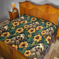 Green sloth quilt with yellow-orange flowers, spread on a wooden bed