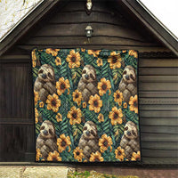 Green sloth quilt with yellow flowers, hanging on a wooden shed wall