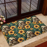Rubber doormat with repeating sloth faces and yellow-orange flowers on dark teal