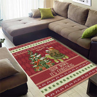 Red Christmas area rug under sofa cushions, sloth and snail riding turtle with garland center