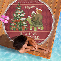 Round Christmas beach blanket with sloth and turtle illustration, red and white fringe edge