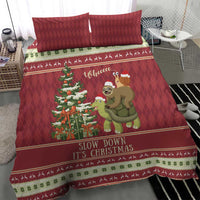 Red Christmas quilt bedding set with sloth riding turtle, tree graphic, and two pillows