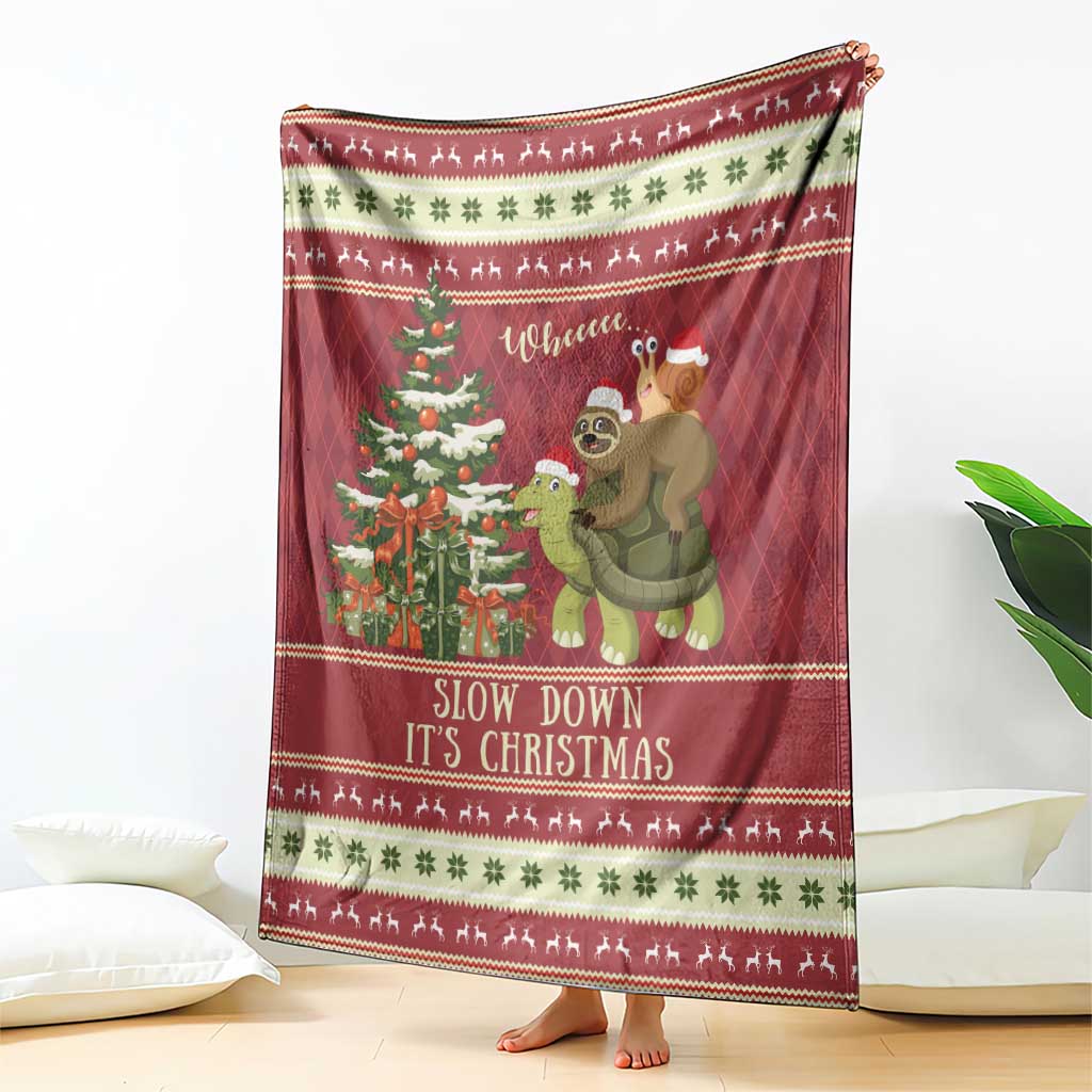 Red Christmas throw blanket hanging display with sloth, turtle, tree and festive borders