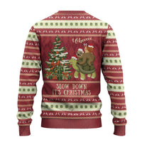 Red ugly Christmas sweater with sloth and turtle by a Christmas tree and “Slow Down It’s Christmas”