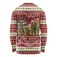 Red crewneck long-sleeve Christmas shirt with all-over sloth riding turtle print