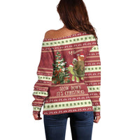 Women’s back view off-shoulder red Christmas sweater with sloth/turtle holiday graphic