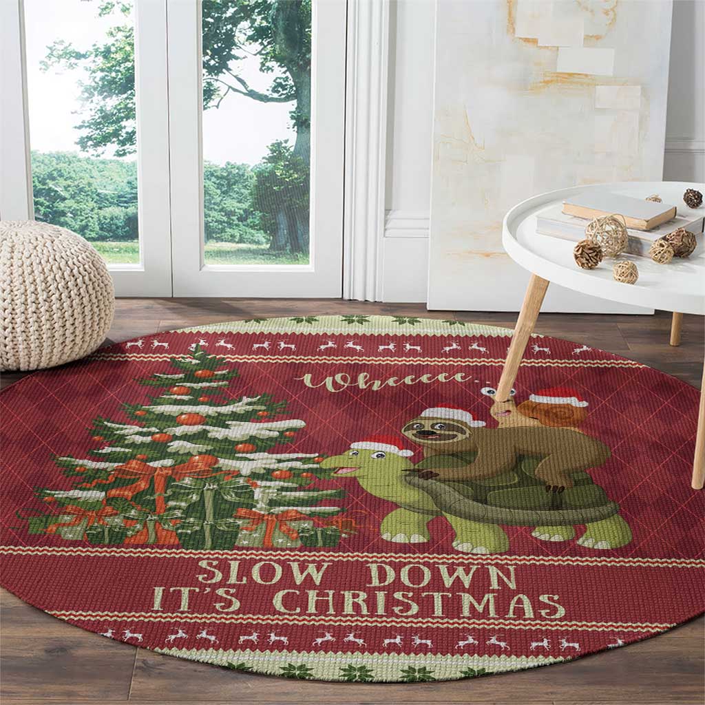 Red round Christmas rug with sloth, snail, and turtle graphic plus 'Slow down It's Christmas'