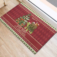 Red rubber Christmas entry mat with sloth and snail on a turtle, 'Slow Down It's Christmas'