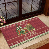 Red Christmas doormat featuring a sloth and snail riding a turtle, bordered with 'Slow Down It's Christmas'