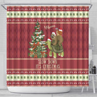 Red Christmas shower curtain featuring sloth and snail on turtle, pine tree, and 'Slow down'