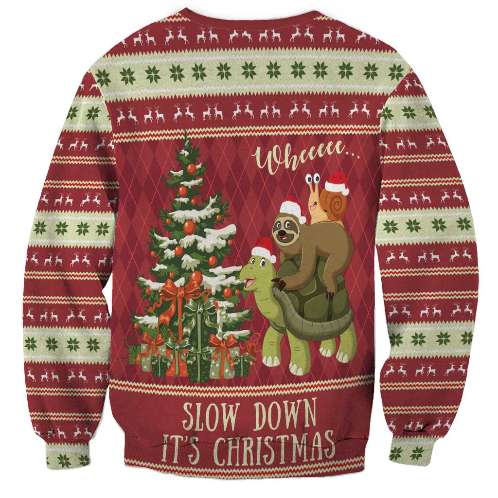 Red unisex Christmas sweatshirt with sloth-and-snail riding a turtle, tree graphic, 'Slow Down It's Christmas'