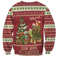 Red unisex Christmas sweatshirt with sloth-and-snail riding a turtle, tree graphic, 'Slow Down It's Christmas'
