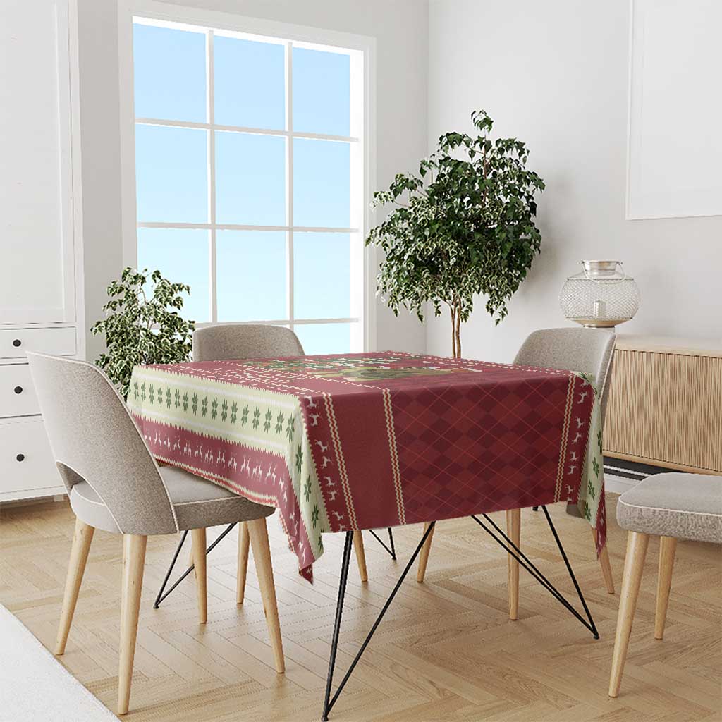 Red Christmas tablecloth with sloth and turtle scene and green-and-white border