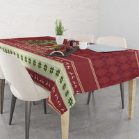 Red Christmas tablecloth corner with green clover stripe and white patterned trim