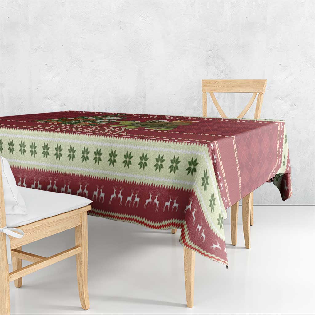 Red Christmas tablecloth with green clover pattern and holiday animal silhouettes