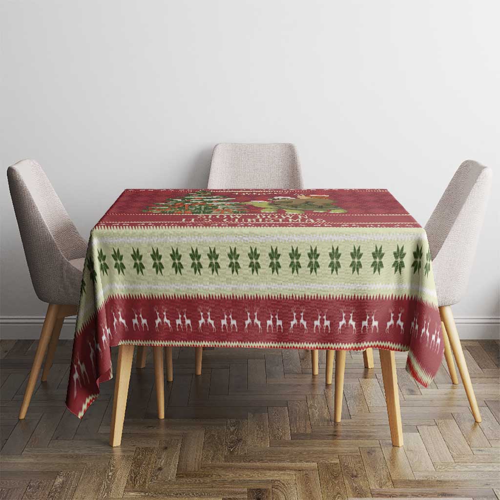 Red Christmas tablecloth with green clover strip and reindeer-style border pattern