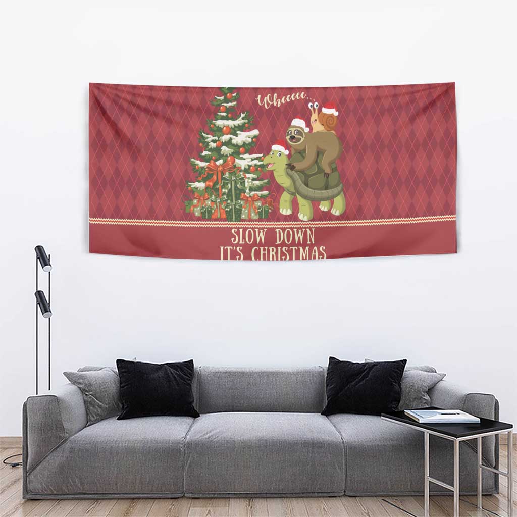 Red Christmas wall tapestry with sloth and snail riding a turtle, pine tree, and “Slow Down”