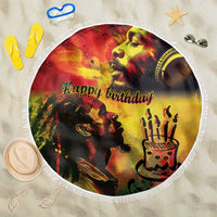 Round reggae-themed beach blanket with fringe, 'Happy birthday' graphic and king portrait