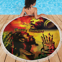 Round reggae-themed beach blanket with fringe, 'Happy birthday' king portrait and candle cake icon