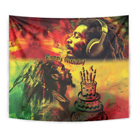 Close-up reggae birthday tapestry with headphones portrait, 'Happy birthday', and cake with candles