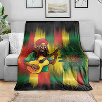 Bob birthday blanket featuring guitarist holding a guitar, green red yellow streaks on sofa