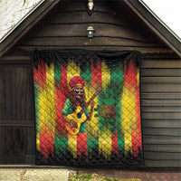 Reggae quilt hanging outdoors, Bob portrait playing guitar with multicolor striped backdrop