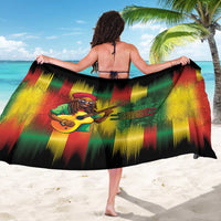 Printed sarong with back graphic of a reggae guitarist on black, red, green, yellow