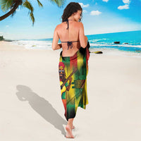 Reggae guitarist portrait sarong with black background and red, green, yellow gradient print