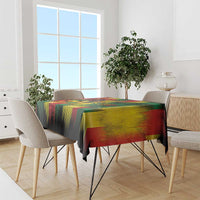 Colorful reggae pattern tablecloth with red, yellow, green stripes on a black base