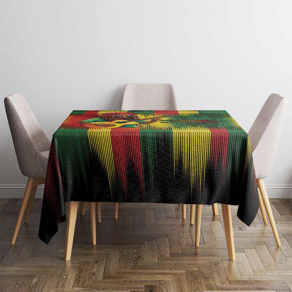 Rectangular reggae striped tablecloth in red, green, and yellow on a black base