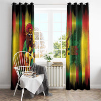 Reggae window curtain panels hung with black top rings and guitarist artwork in rainbow